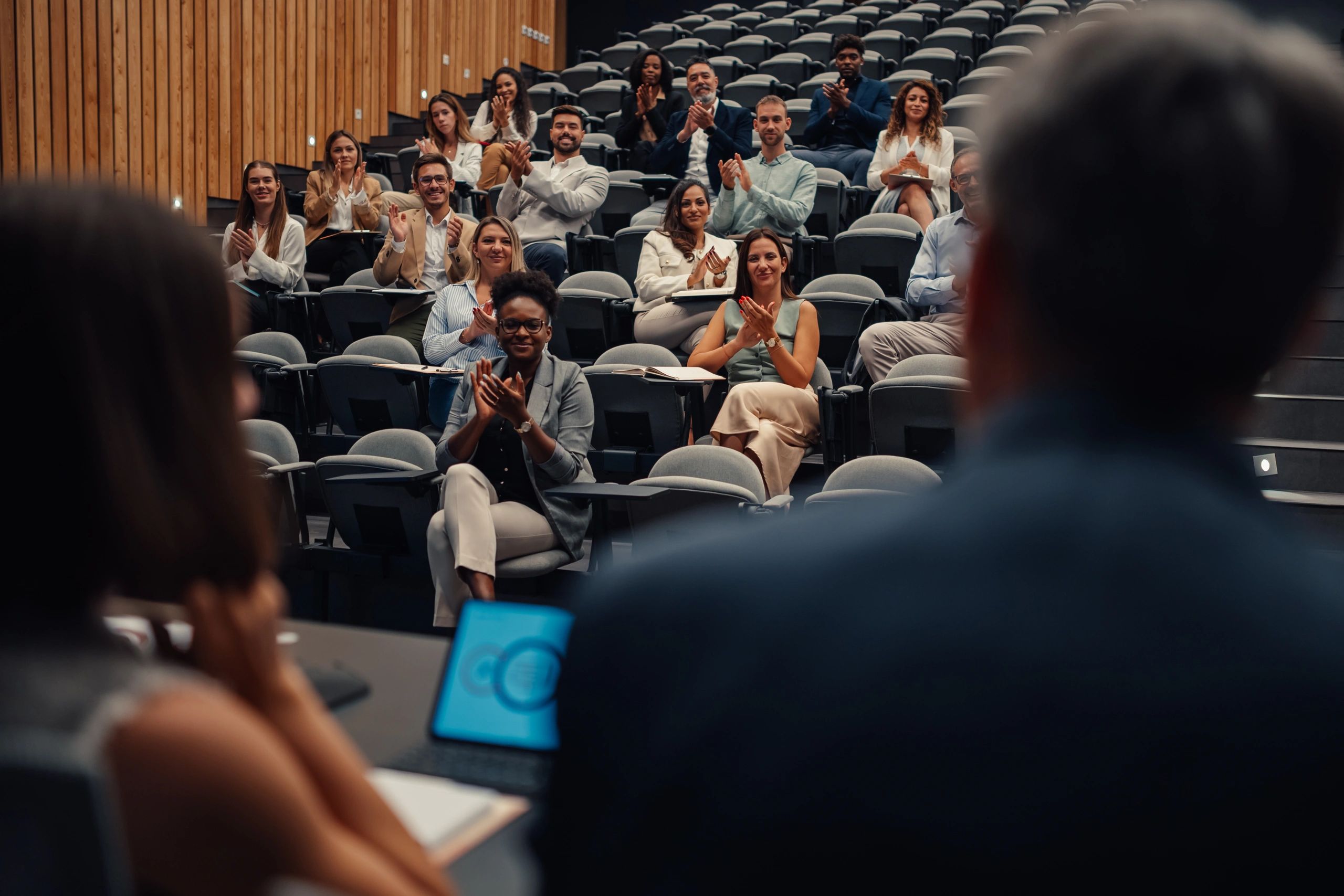 Audience applauding during a speaking event